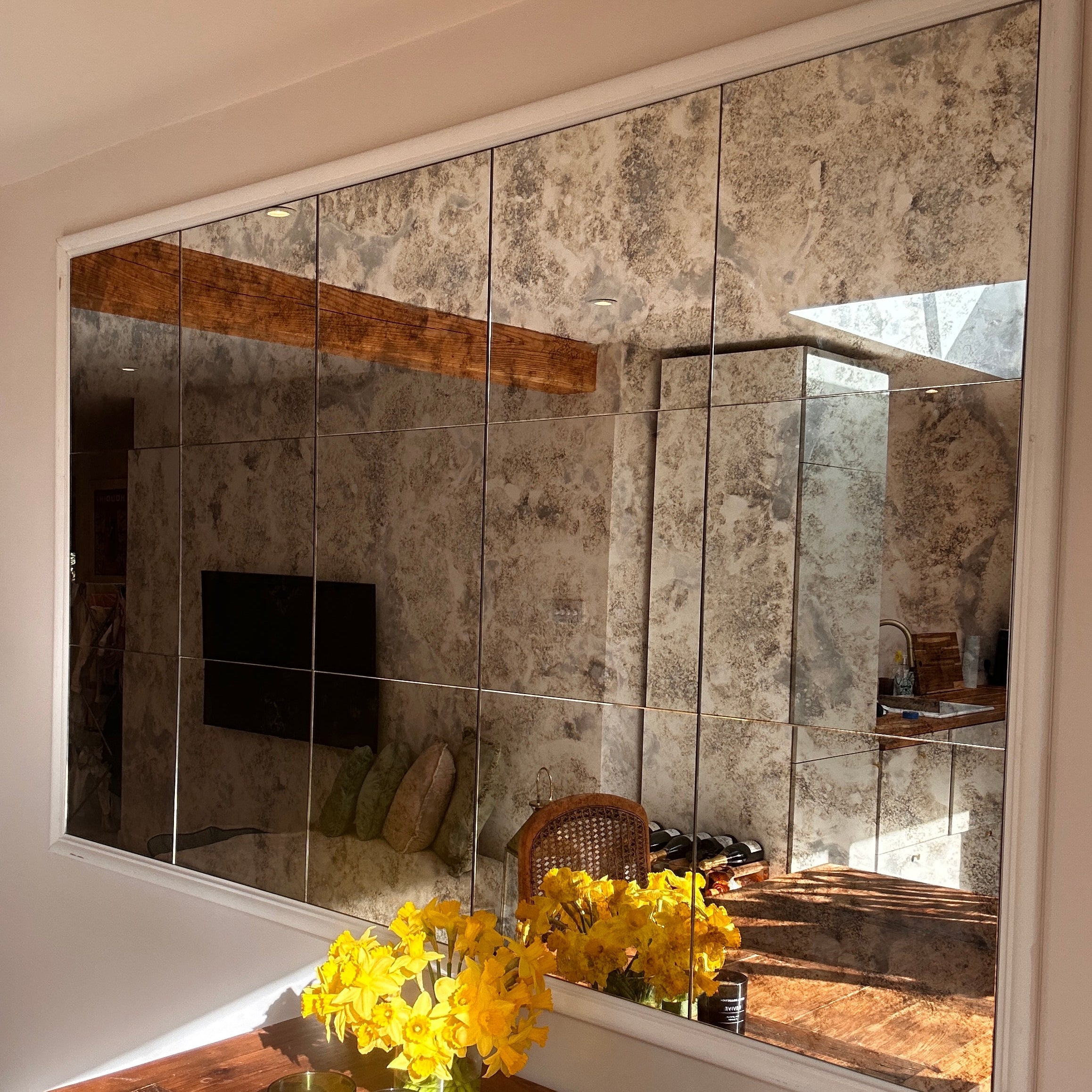 Kitchen Wall filled with Antique Mirror Tiles in the spring sunshine