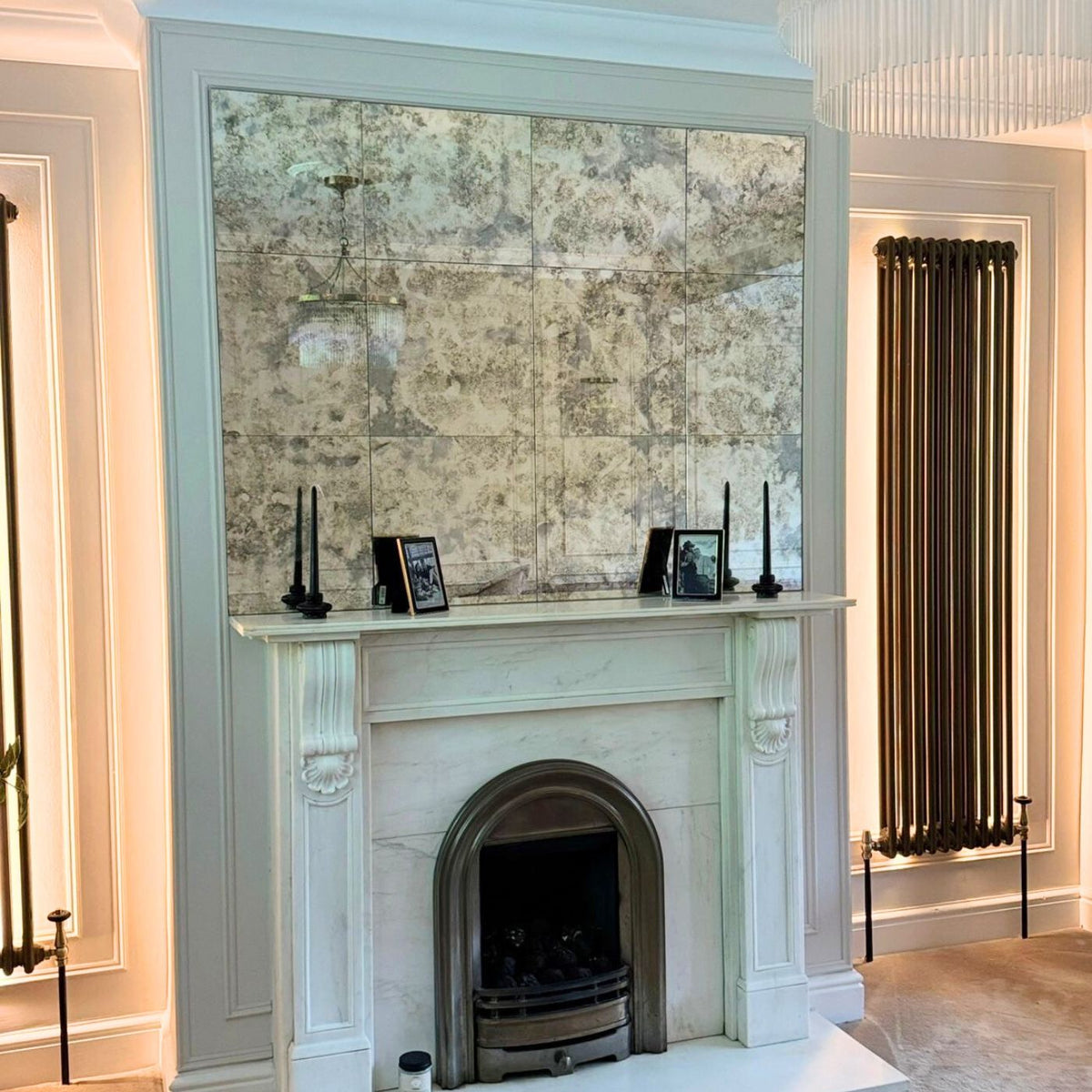 Antique mirror tile splashback in a painted kitchen
